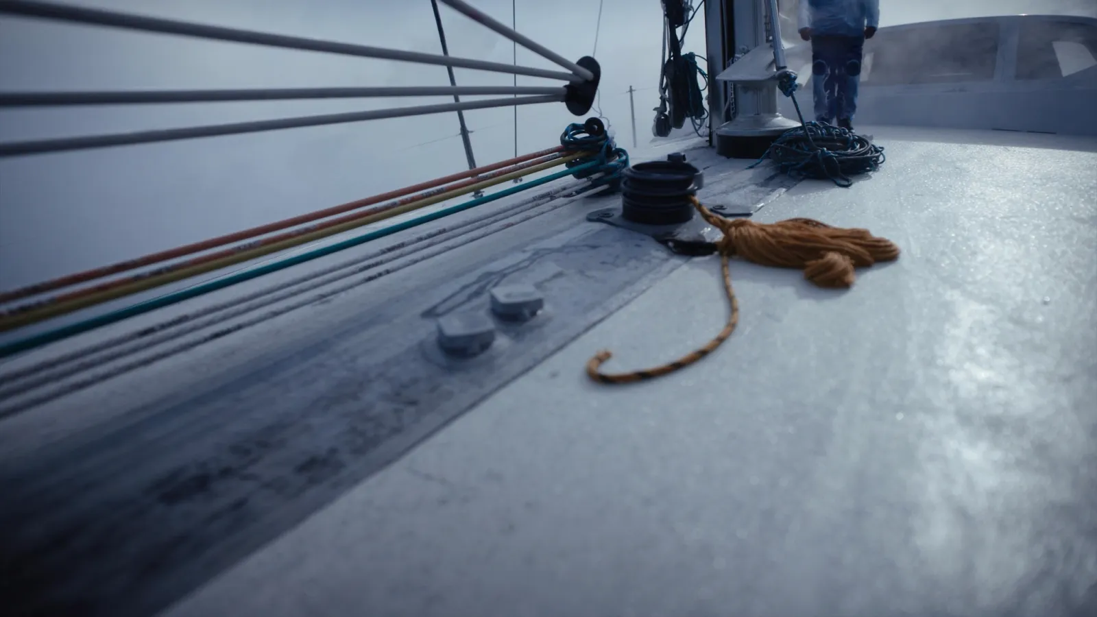 Colour coded halyards and sheets at the mast foot of a cruising yacht