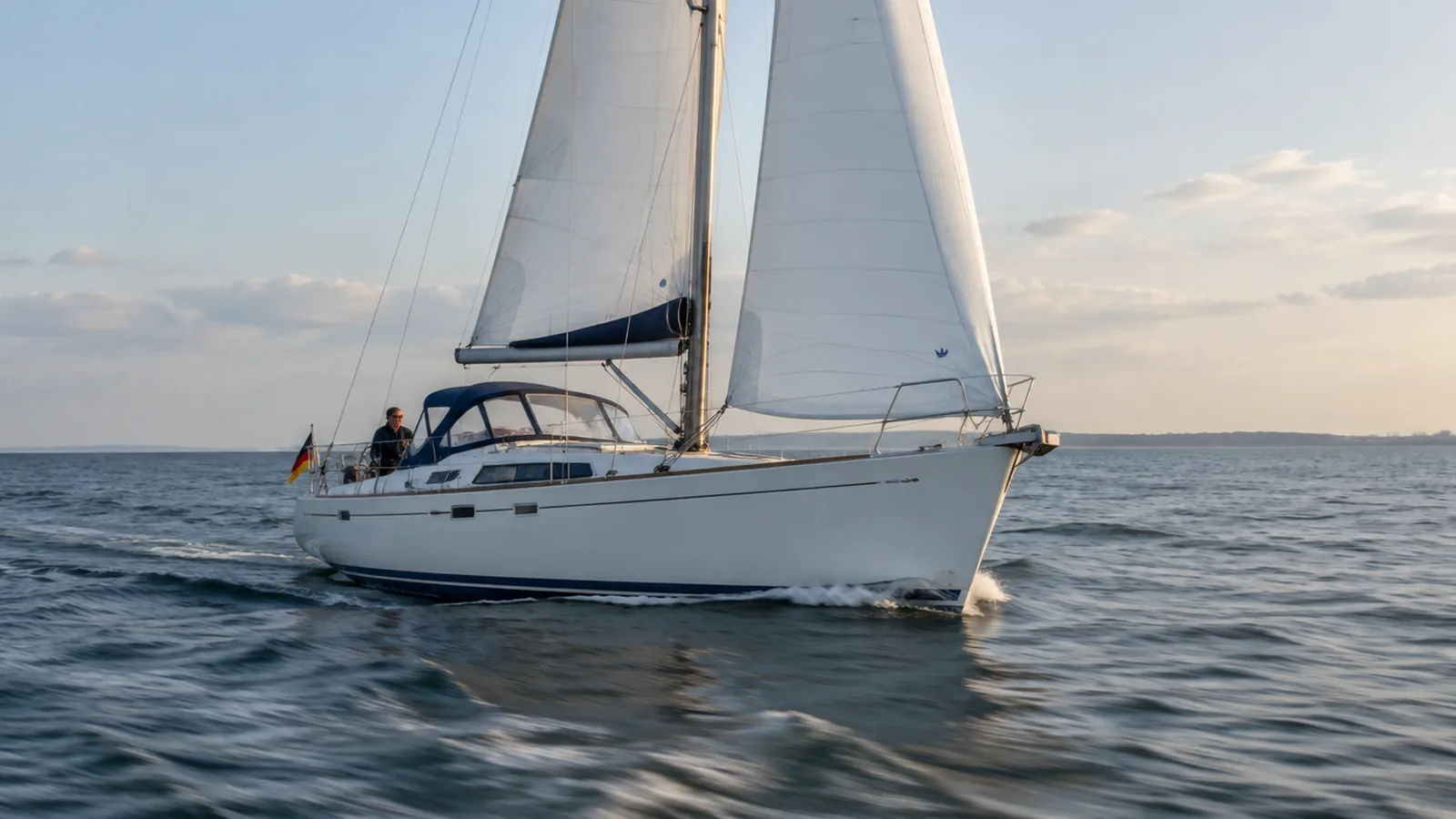 Sailing boat under full sail
